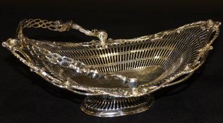 A late Victorian silver swing-handled fruit basket with harebell,