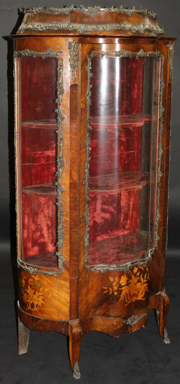 A 19th Century mahogany and inlaid Vitrine of shaped form with applied brass decoration,