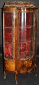 A 19th Century mahogany and inlaid Vitrine of shaped form with applied brass decoration,