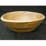 A 19th Century treen ware bowl on footed base, 23.