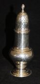 A George III silver caster of typical baluster form (by Robert Peaston, London, 1763), 14.