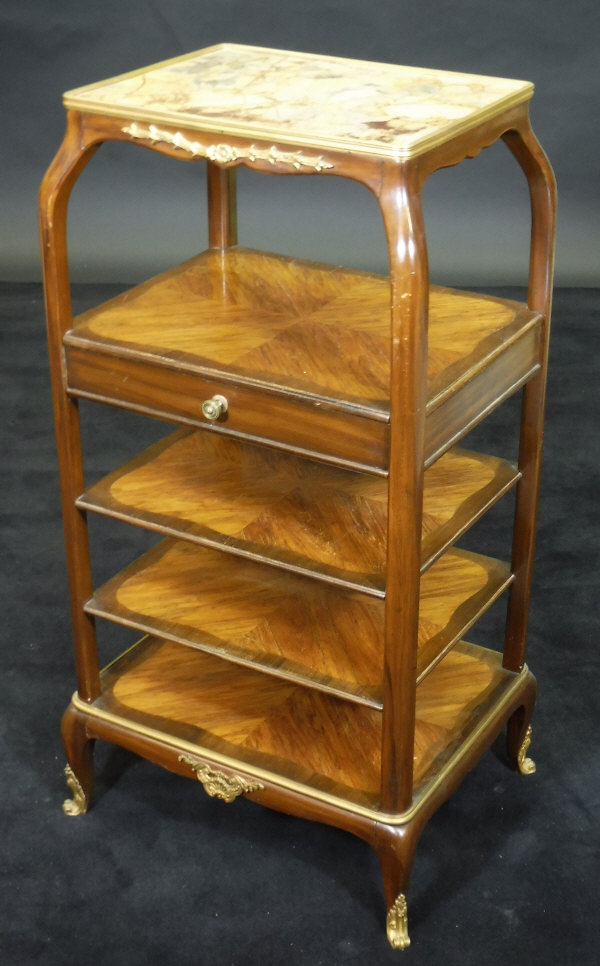 A circa 1900 French kingwood whatnot, the Siena type marble top within a gilt brass edge,