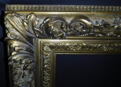 A 19th Century gilt and gesso decorated picture frame with heavy acanthus and C scrolling