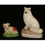 A Staffordshire flat back figure of a seated collie type dog with a cream coat, 15 cm high,