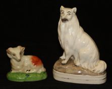 A Staffordshire flat back figure of a seated collie type dog with a cream coat, 15 cm high,