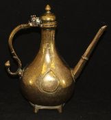 An 18th Century Indian brass Deccan ewer with acorn finial to the lid, S shaped handle,