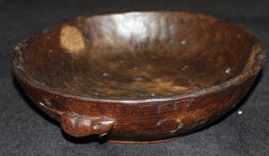 A dark oak adzed fruit bowl by Robert Thompson of Kilburn (The Mouseman) with typical mouse motif,