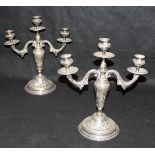 A pair of late 19th Century / early 20th Century white metal three light two branch candelabra with