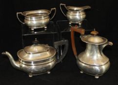 A George V silver four piece tea set comprising teapot, hot water jug,