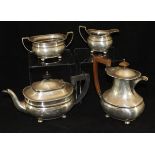 A George V silver four piece tea set comprising teapot, hot water jug,