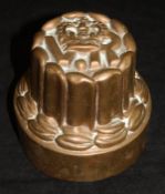 A Benham & Froud tin-lined copper jelly mould, the tiered sides to a crown and "VR",