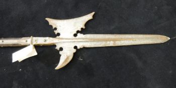 A 17th Century German halberd with shaped blade on a faceted iron bound pole (Provenance: Coughton