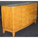 LIANE J FLAMENT - an early 20th Century Art Deco amboyna serpentine fronted commode,