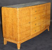 LIANE J FLAMENT - an early 20th Century Art Deco amboyna serpentine fronted commode,