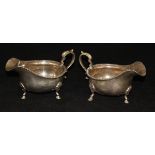 A pair of George V silver sauceboats in the Georgian taste with gadrooned edges,
