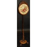 An early Victorian rosewood pole screen,