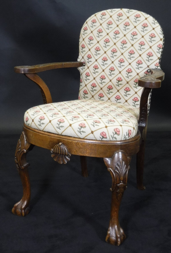 A late 19th Century oak elbow chair in the Irish manner,