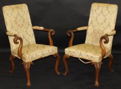 A pair of 19th Century mahogany arm chairs in a green and yellow flock upholstery,