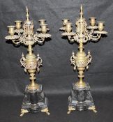 A pair of 19th Century brass four branch candelabra,