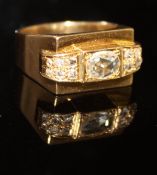 An un-marked gold dress ring in the Modernist style, set with central oval cut diamond, approx 0.