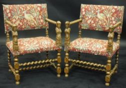 A pair of mid-19th Century elbow chairs, in the Carolean manner,