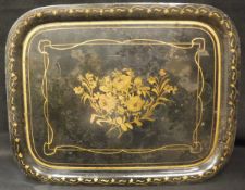 A late 18th / early 19th Century toleware tray decorated with a golden laurel spray on a black