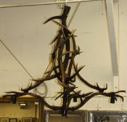 A four branch electrolier in the form of various interlocking antlers,