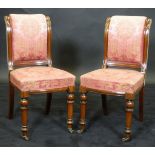 A set of six 19th Century mahogany framed dining chairs with pink ground upholstery,