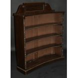 A 19th Century faux rosewood four tier bookcase of concave form,
