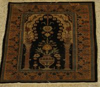 A fine silk prayer rug, the central panel set with Mihrab design on a black and cream ground,