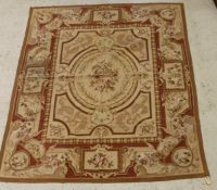 A modern Aubusson rug, the central panel set with a spray of roses on a cream ground,