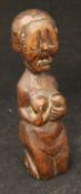 An early medival oak carved fertility statue, perhaps 14th or 15th Century,