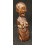 An early medival oak carved fertility statue, perhaps 14th or 15th Century,