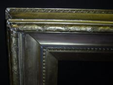 A large 19th Century gilt and gesso picture frame with leaf and berry decoration, 139 cm x 164.