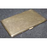 A 9 carat gold cigarette case with engine turned decoration to front and back,