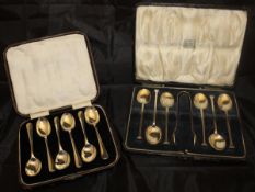 A cased set of six silver teaspoons and a pair of plated sugar tongs