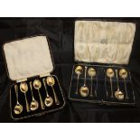 A cased set of six silver teaspoons and a pair of plated sugar tongs