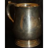 A George V silver Christening mug of baluster form with scrolling handle,