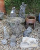 A collection of various modern composite stone garden ornaments to include a penguin, rabbit, owl,