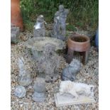 A collection of various modern composite stone garden ornaments to include a penguin, rabbit, owl,