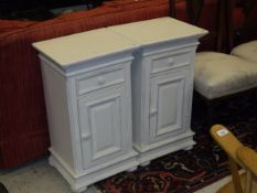A pair of modern cream painted bedside cupboards,