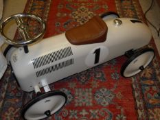 A modern Vilac toy pushalong car