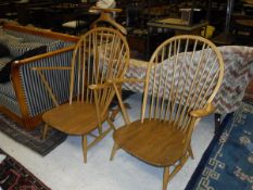 A pair of modern Ercol light elm and beech elbow chairs CONDITION REPORTS No