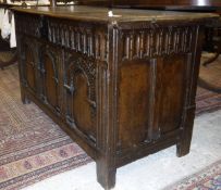 An 18th Century carved oak coffer,
