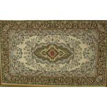 A large tapestry panel with central lozenge shaped medallion in puce, mustard, emerald,