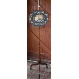 A 19th Century mahogany pole screen with long stitch silk needlework panel depicting floral spray