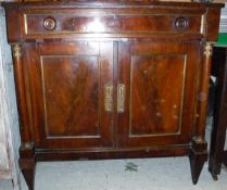 A 19th Century French mahogany side cabinet with single drawer above two cupboard doors flanked by