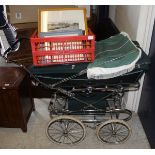 A Silver Cross pram in British racing green, together with a collection of assorted pictures,