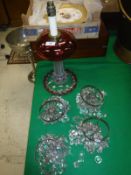 A Victorian cranberry glass and clear glass oil lamp base (converted to electricity),