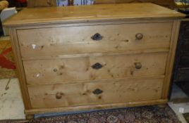 A Continental pine commode of three drawers,